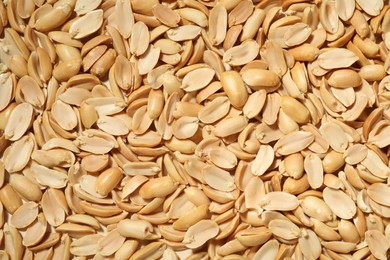 Photo of Fresh peeled peanuts as background, top view