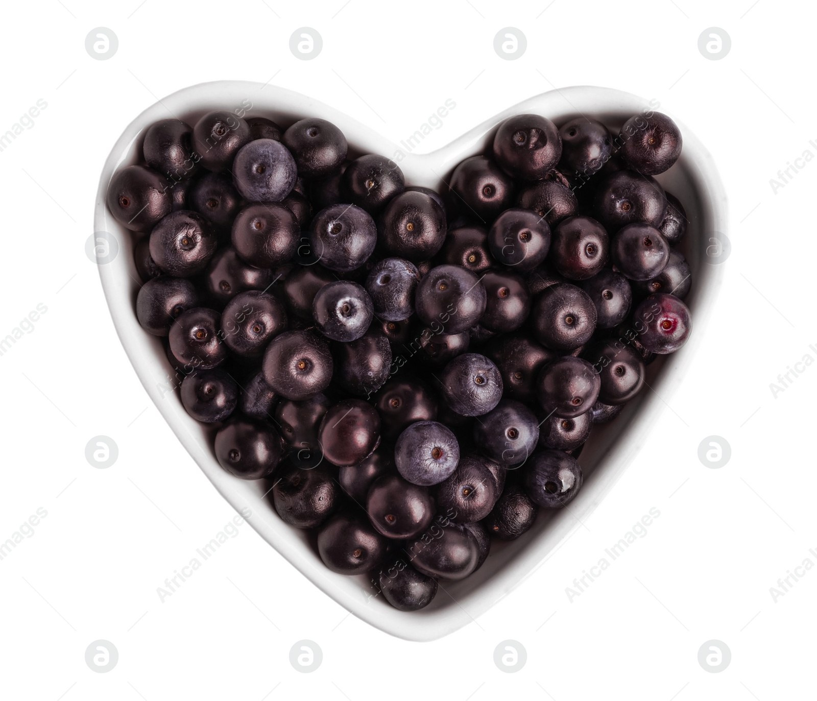 Photo of Heart shaped bowl with fresh acai berries on white background, top view