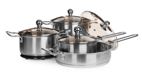 Set of stainless steel cookware on white background