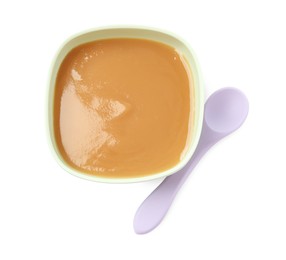 Photo of Tasty baby food in bowl and spoon isolated on white, top view