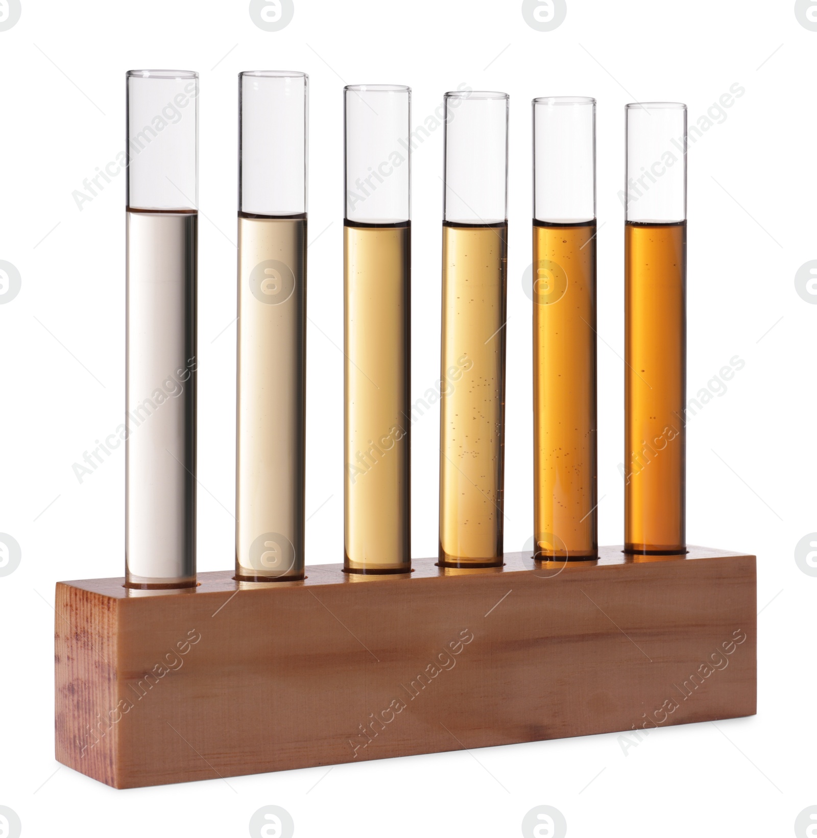 Photo of Test tubes with brown liquid in stand on white background