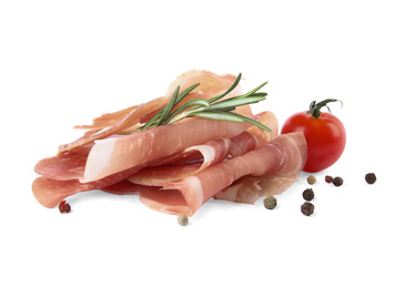 Photo of Delicious prosciutto with rosemary and tomato on white background