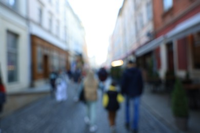 Blurred view of people walking on city street