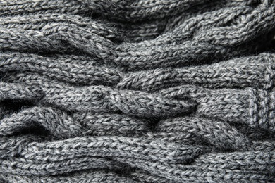 Photo of Soft grey knitted plaid as background, closeup