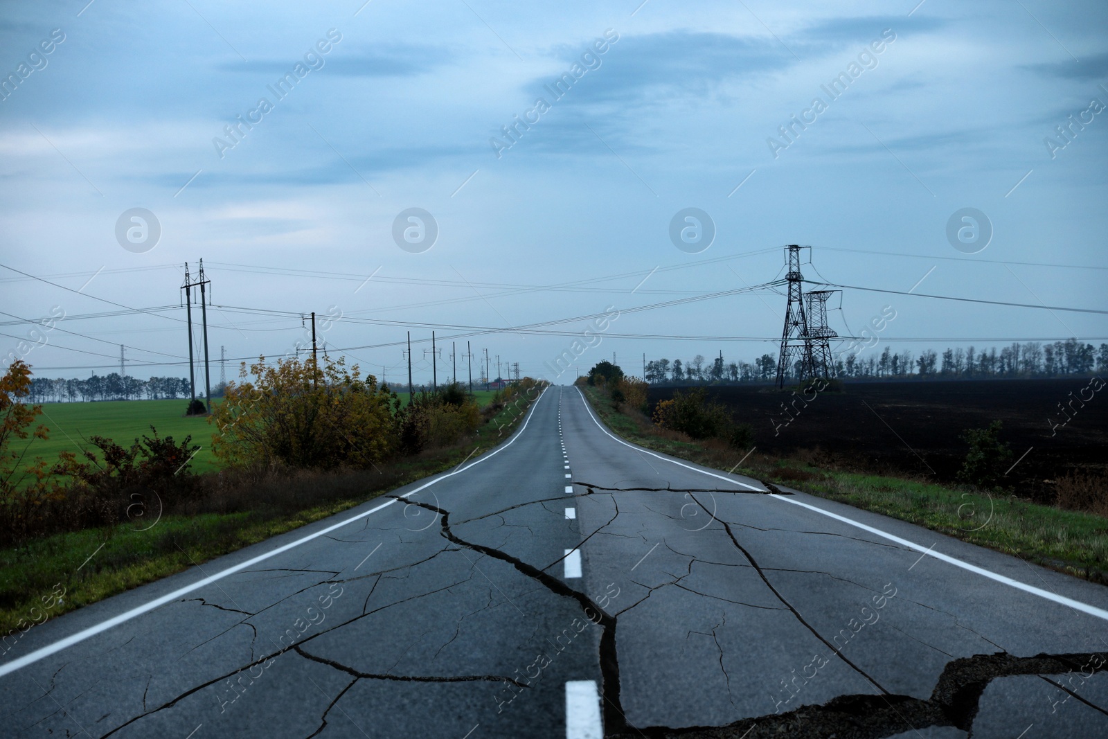 Image of Large cracks on asphalt road after earthquake