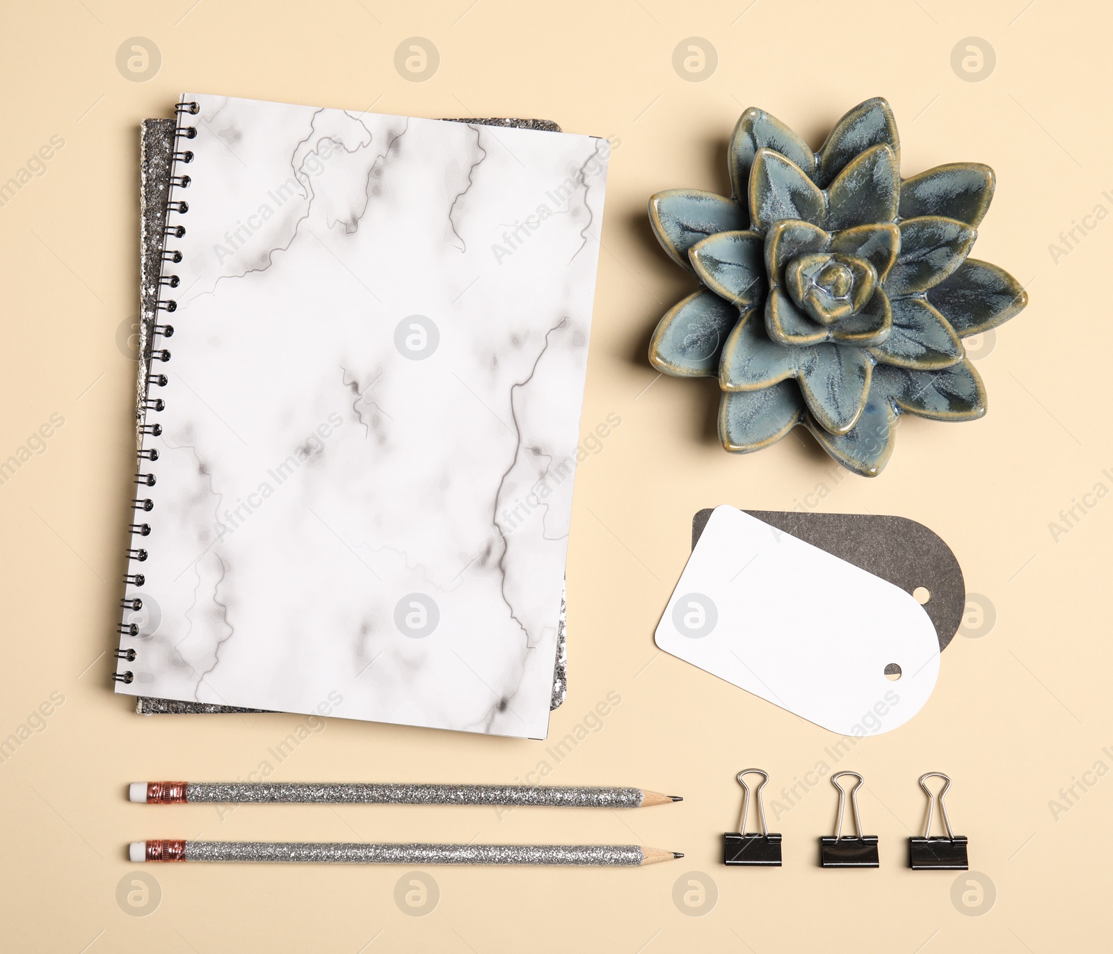 Photo of Flat lay composition with stationery accessories on beige background. Space for design