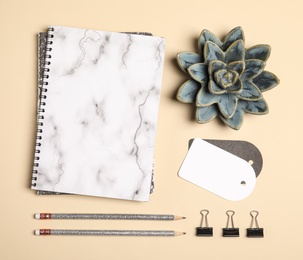 Photo of Flat lay composition with stationery accessories on beige background. Space for design