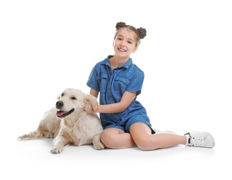 Photo of Cute little child with her pet on white background