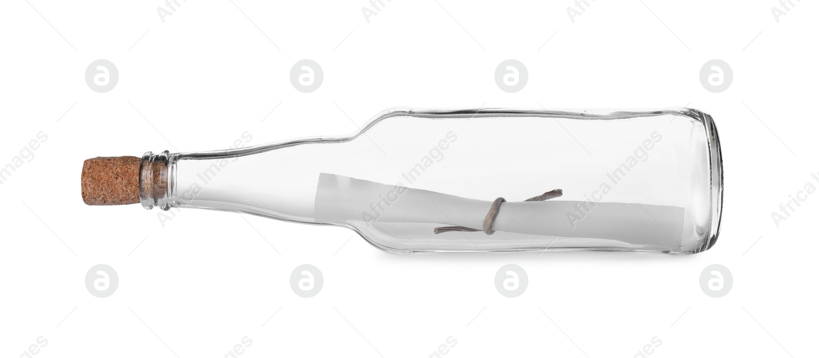 Photo of Corked glass bottle with rolled paper note on white background