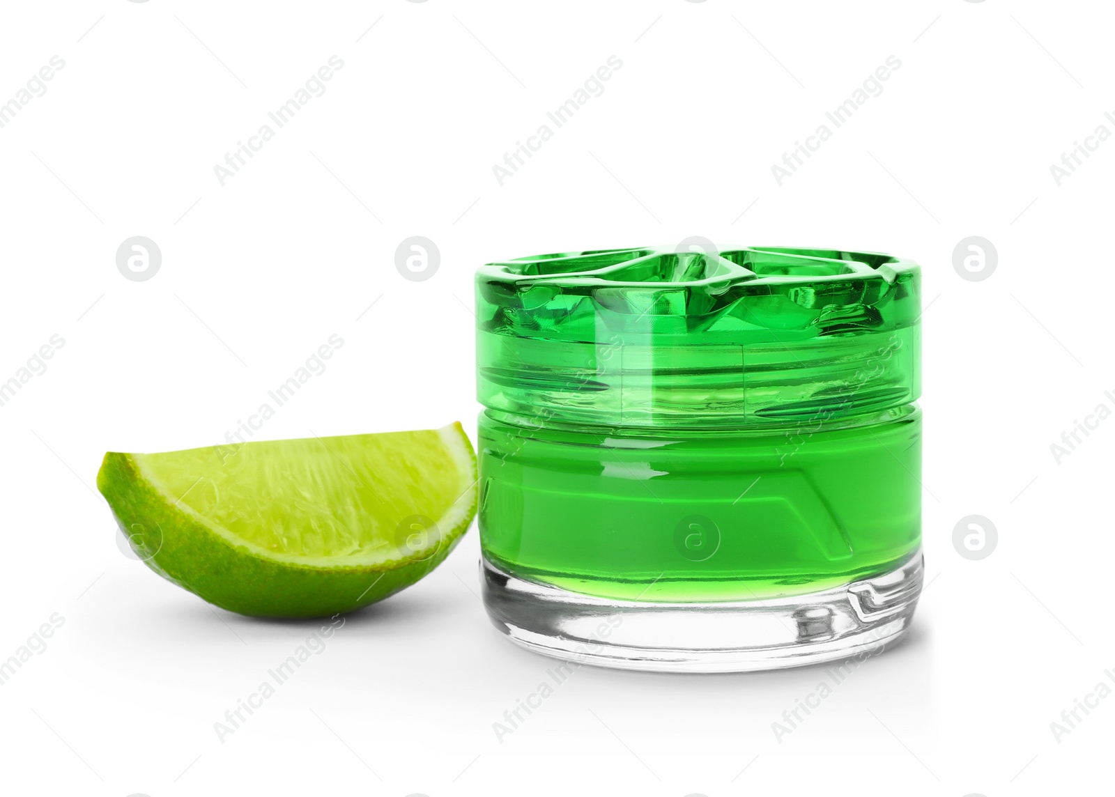 Photo of Aromatic air freshener and slice of lime on white background