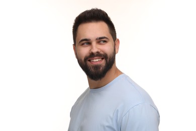 Man with clean teeth smiling on white background