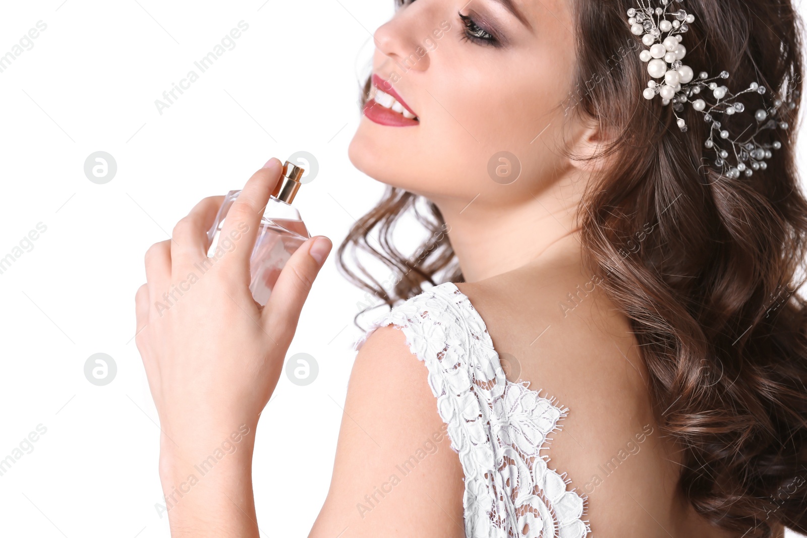 Photo of Beautiful young woman with bottle of perfume on white background