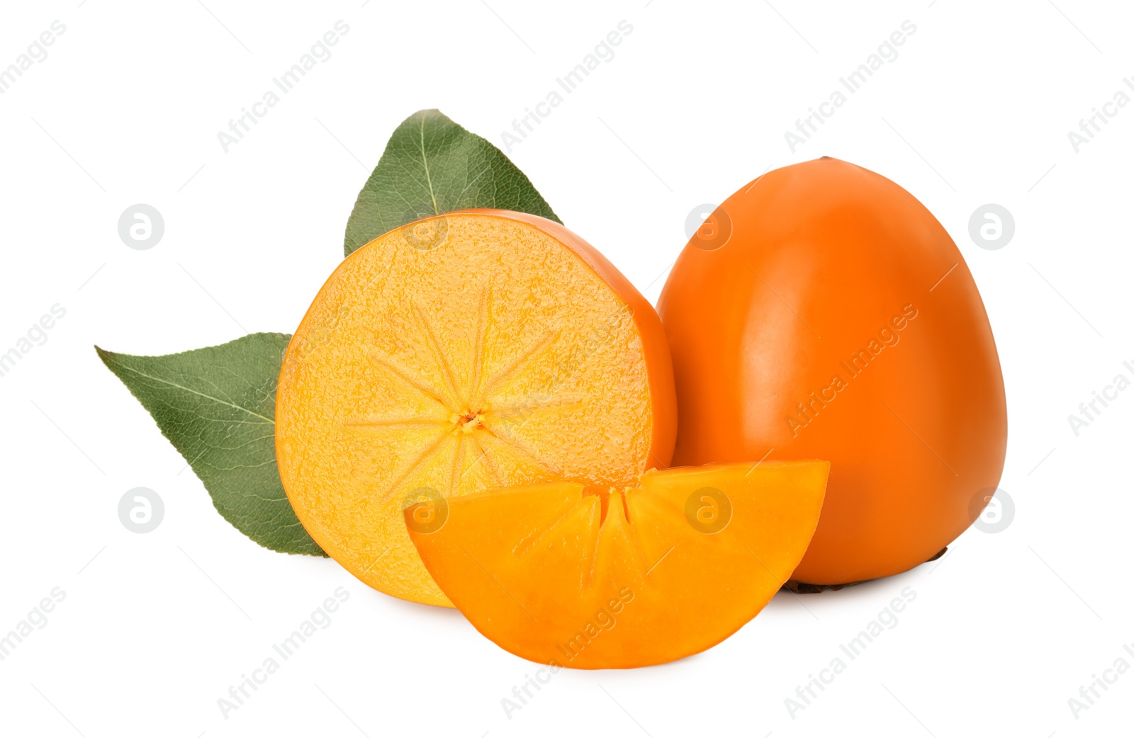 Photo of Whole and cut delicious ripe juicy persimmons on white background