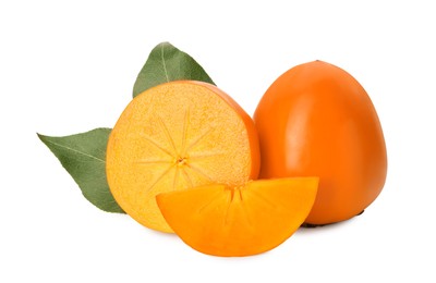 Whole and cut delicious ripe juicy persimmons on white background