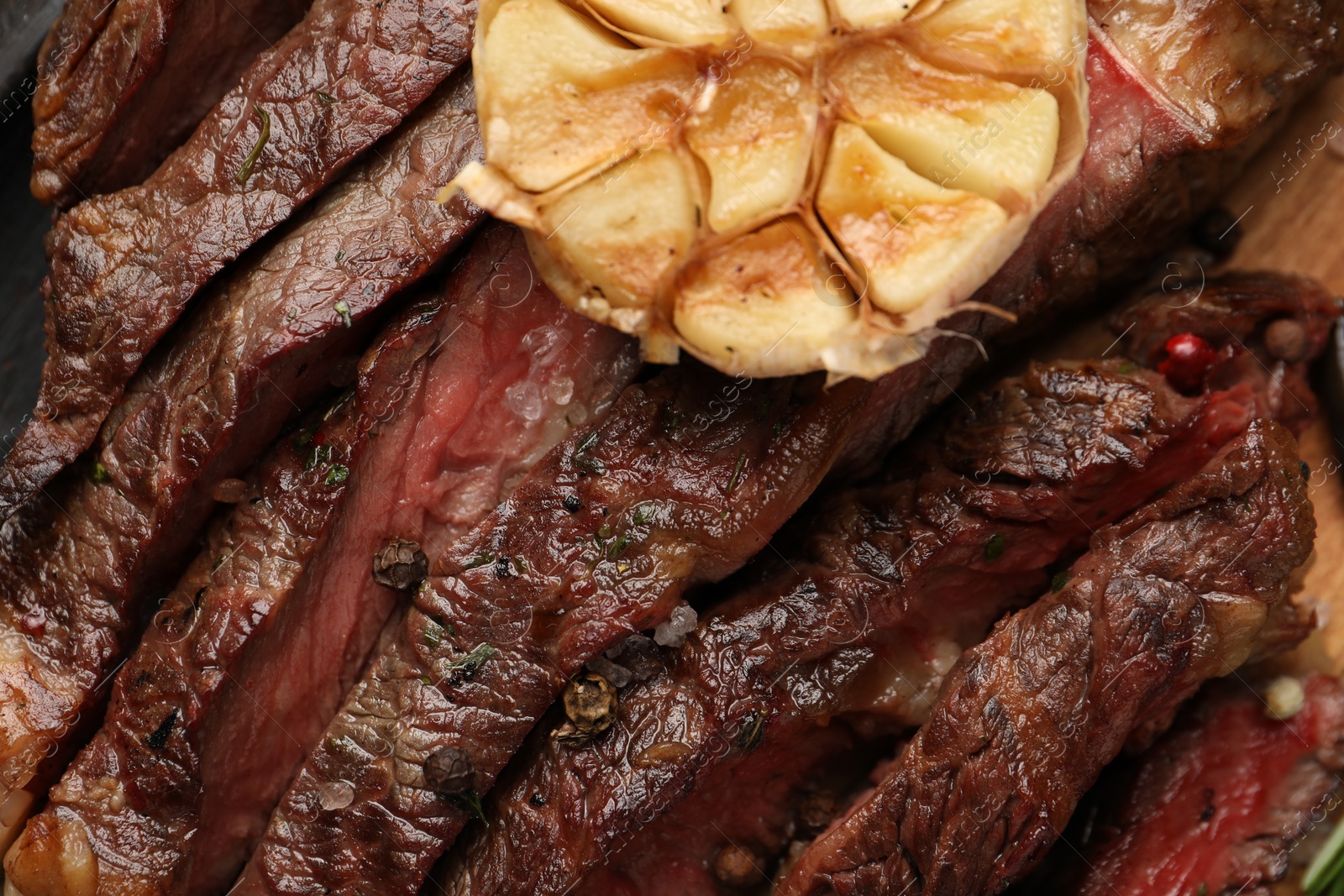 Photo of Delicious grilled beef with spices on table, top view