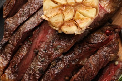 Photo of Delicious grilled beef with spices on table, top view