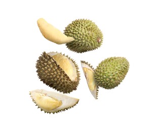 Image of Many ripe durian fruits falling on white background