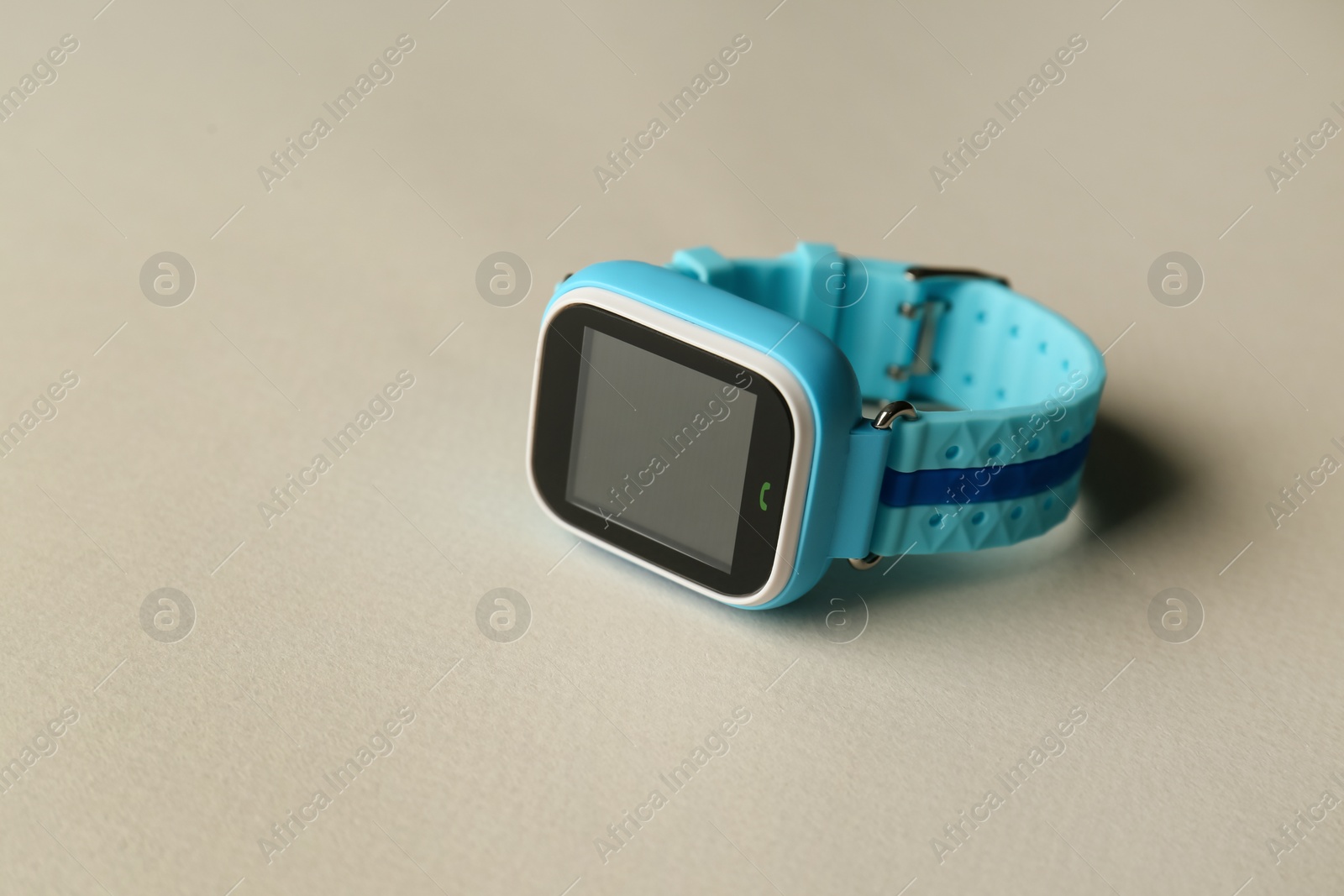 Photo of Modern trendy smart watch for kids on grey background