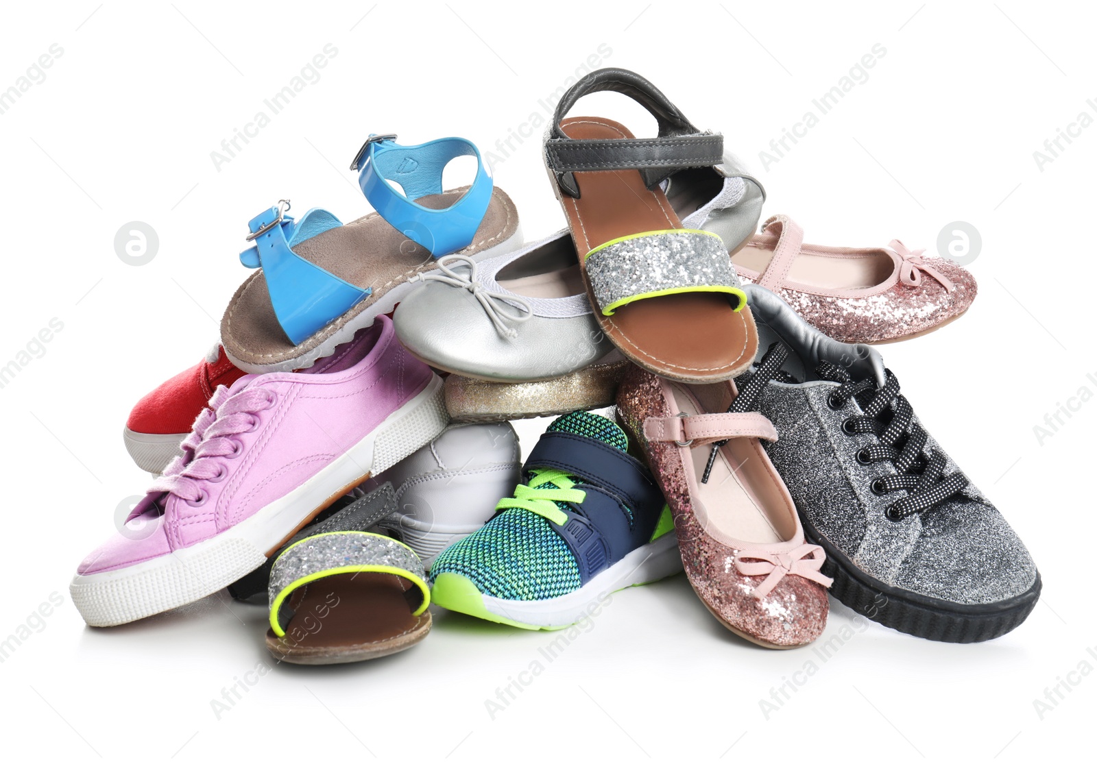 Photo of Pile of different shoes on white background