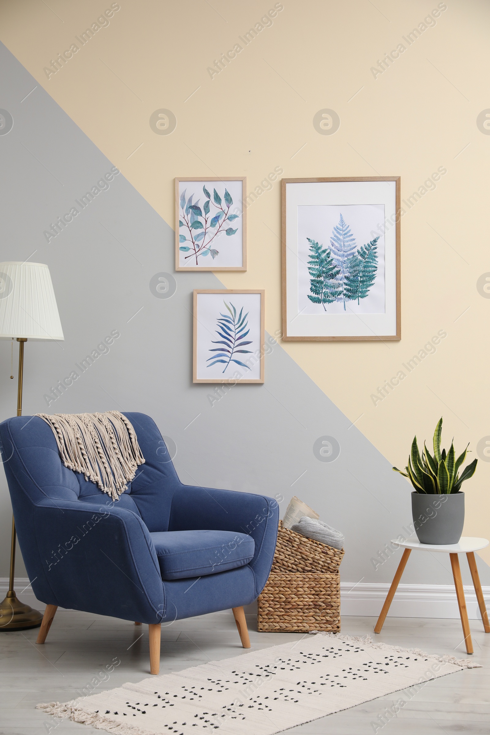 Photo of Stylish room interior design with floral paintings