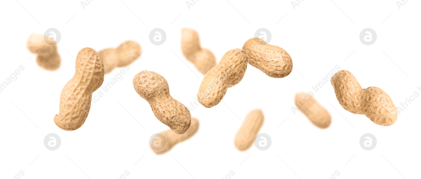 Image of Unpeeled peanuts in air on white background