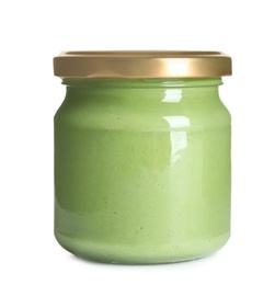 Photo of Delicious wasabi in glass jar on white background. Spicy sauce