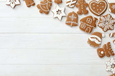 Photo of Many different delicious Christmas cookies on white wooden table, flat lay. Space for text