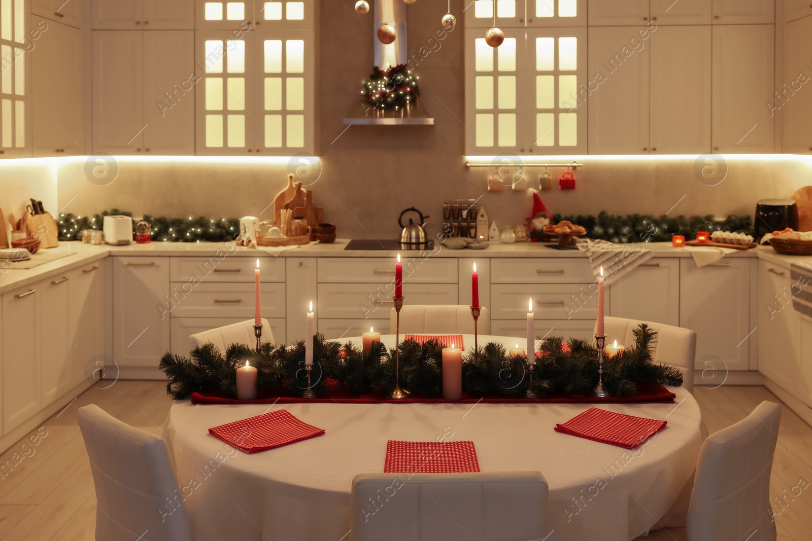 Photo of Cozy spacious kitchen decorated for Christmas. Interior design