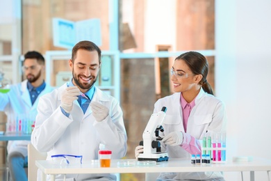 Young scientists working in laboratory. Chemical analysis