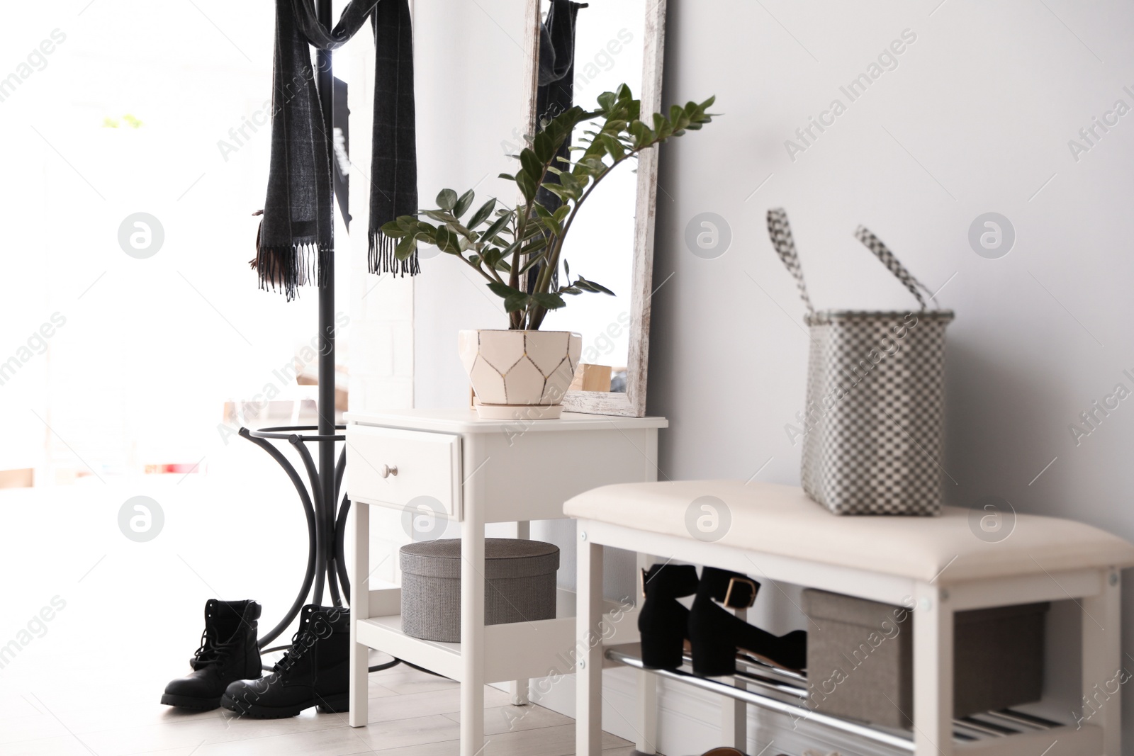 Photo of Stylish hallway interior with large mirror