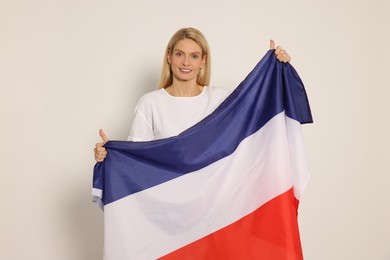 Photo of Woman with flag of Netherlands on white background