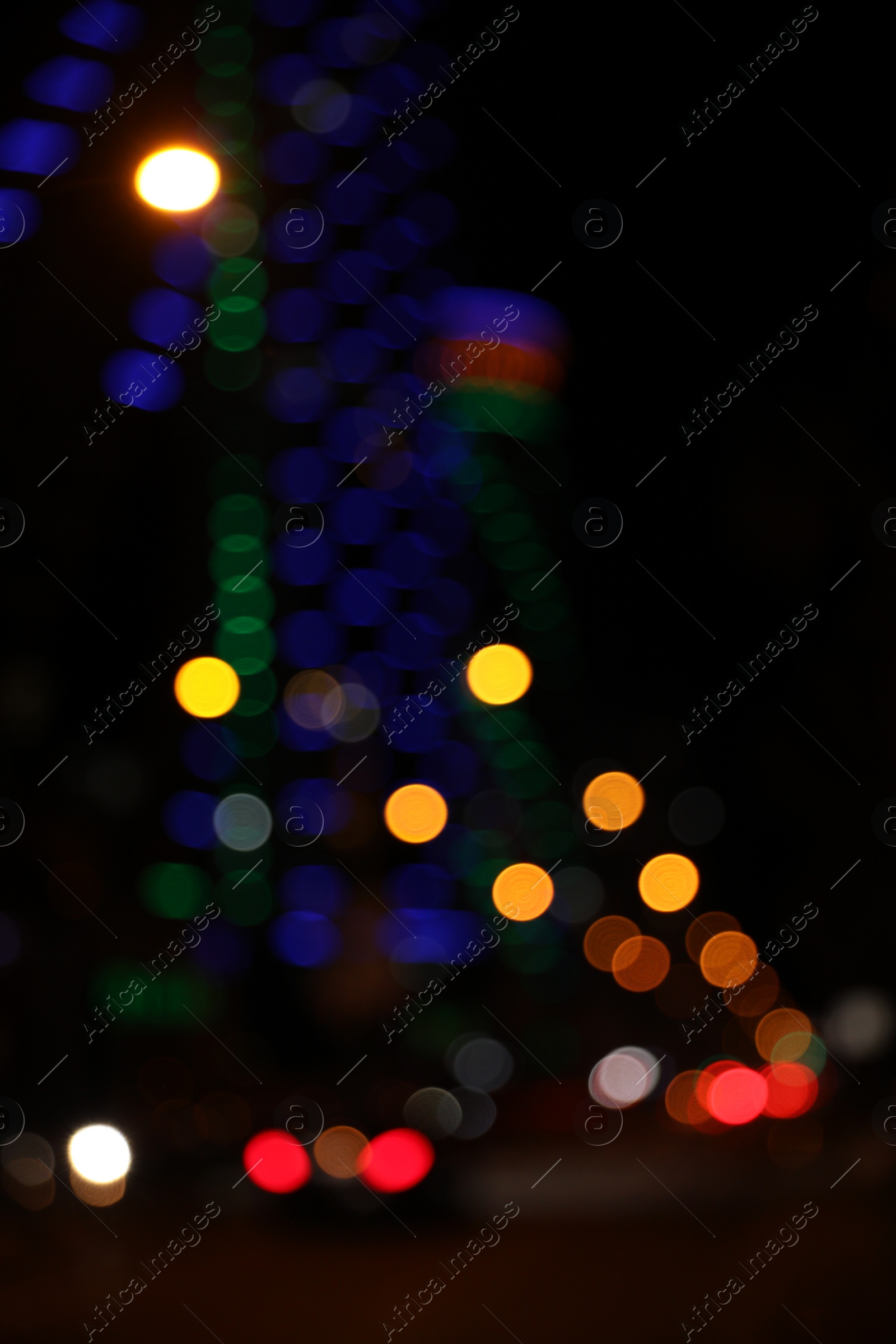 Photo of Blurred view of cityscape with bokeh effect. Night life