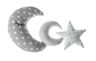 Moon and star shaped decorative pillows on white background