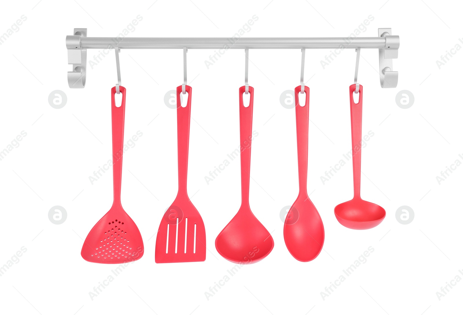 Photo of Metal rack with set of red kitchen utensils on white background