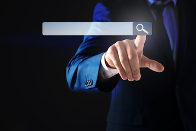 Image of Businessman using search bar on virtual screen, closeup