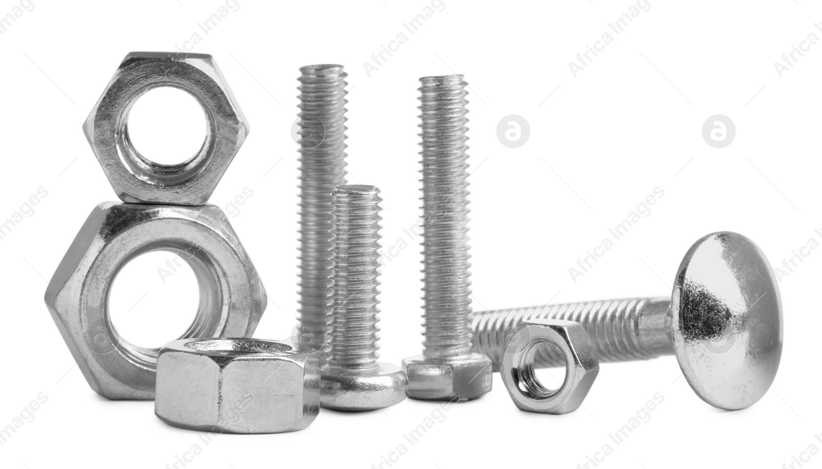 Photo of Different metal bolts and nuts on white background