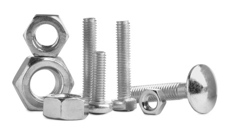 Photo of Different metal bolts and nuts on white background