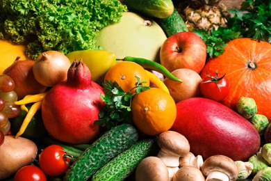 Photo of Assortment of fresh organic fruits and vegetables as background, closeup