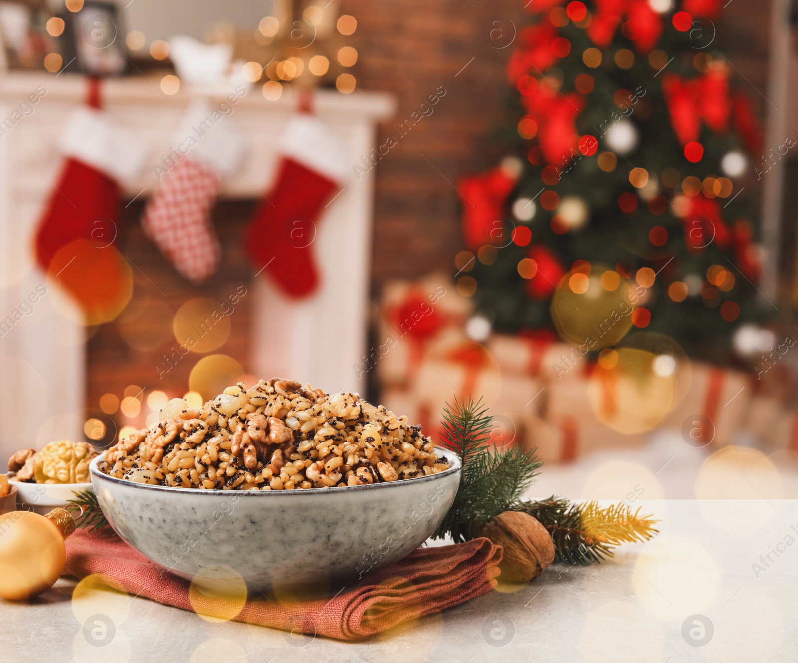 Image of Traditional Christmas slavic dish kutia on table in decorated room