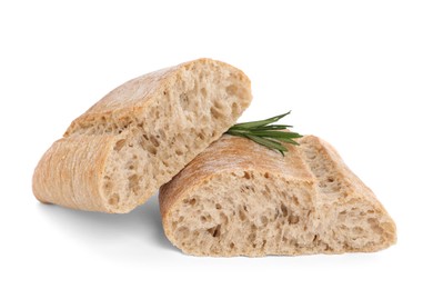 Photo of Cut ciabatta with rosemary on white background. Fresh bread