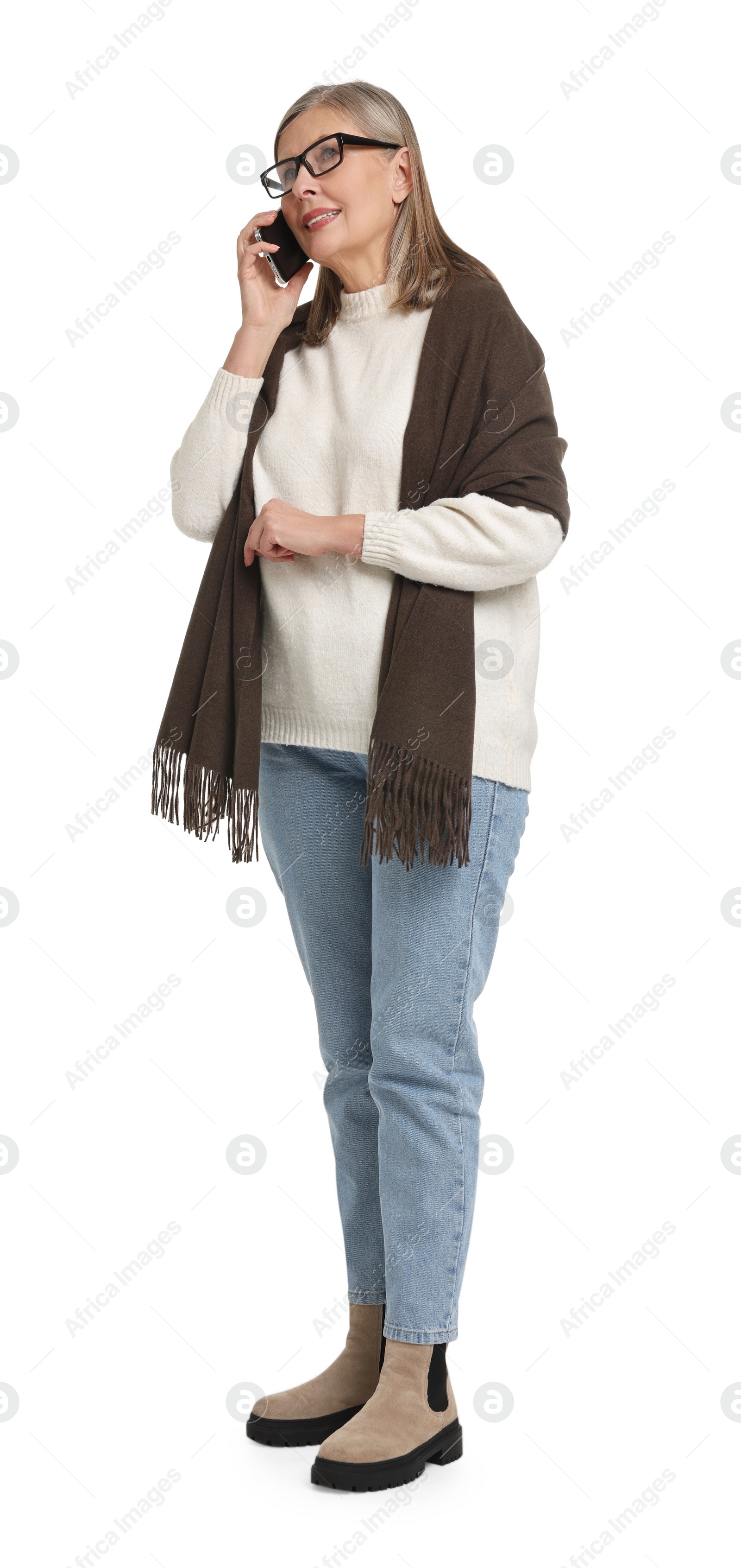 Photo of Senior woman with bag talking on smartphone against white background