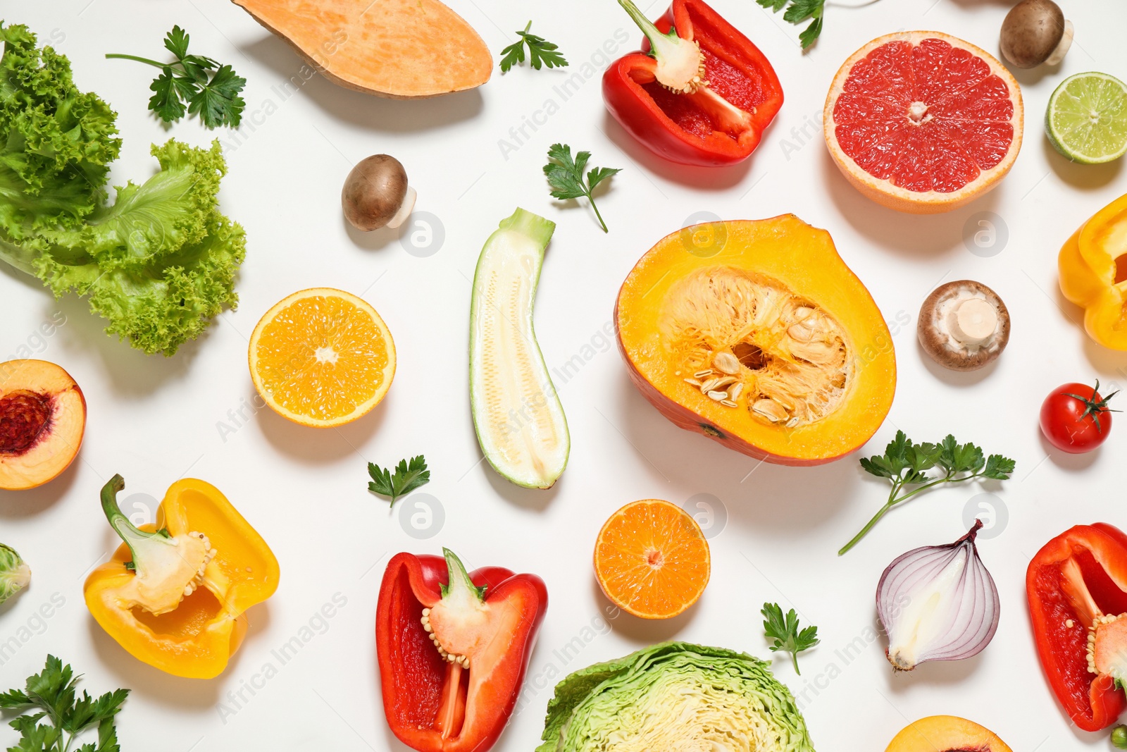 Photo of Fresh organic fruits and vegetables on white background, flat lay