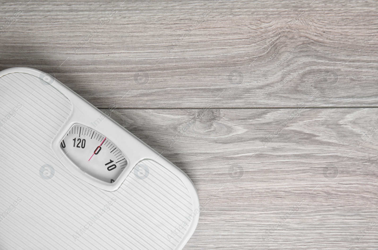 Photo of Scales on wooden background, top view with space for text. Weight loss