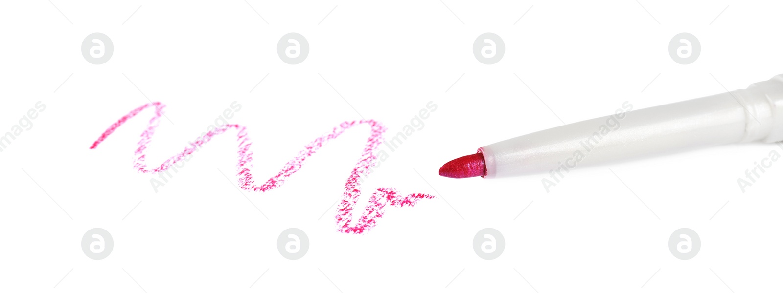 Photo of Bright lip liner stroke and pencil on white background