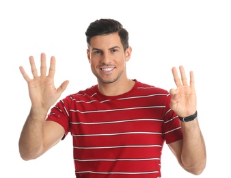 Man showing number eight with his hands on white background