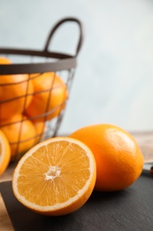 Photo of Fresh juicy oranges on cutting board. Healthy fruit