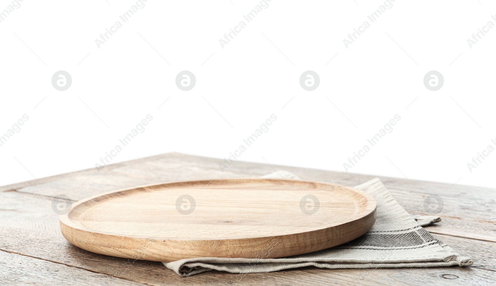 Photo of Empty plate and napkin on wooden table against white background