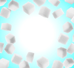 Image of Refined sugar cubes in air on light blue gradient background. Space for text