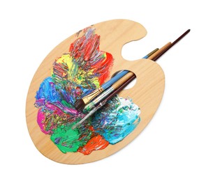 Photo of Palette with paints and brushes on white background, top view. Artist equipment