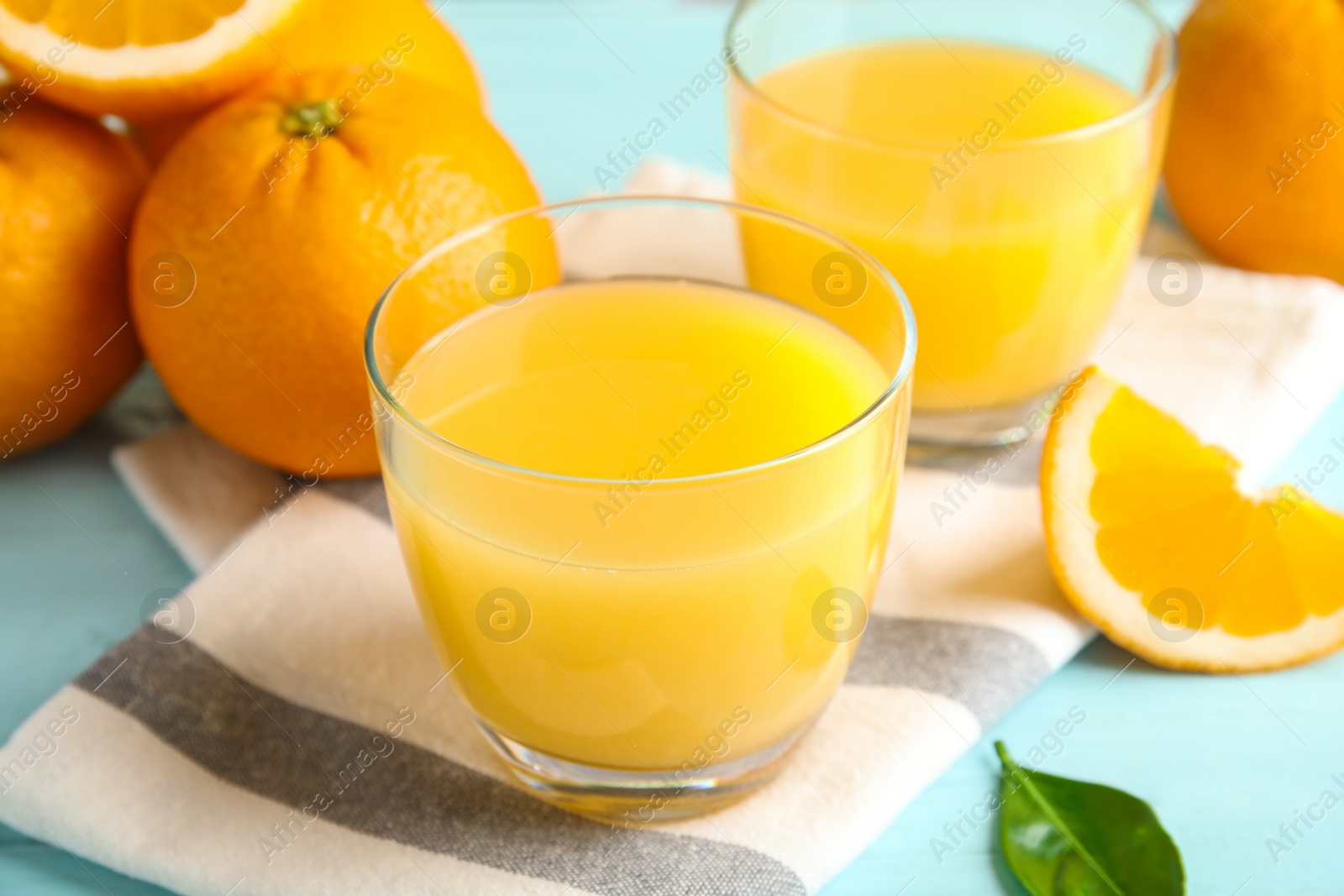 Photo of Composition with orange juice and fresh fruit on table